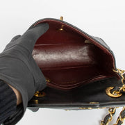 Shop this 100% authentic Chanel Black Lambskin Leather Mini Chevron Flap Bag at labellov.com.