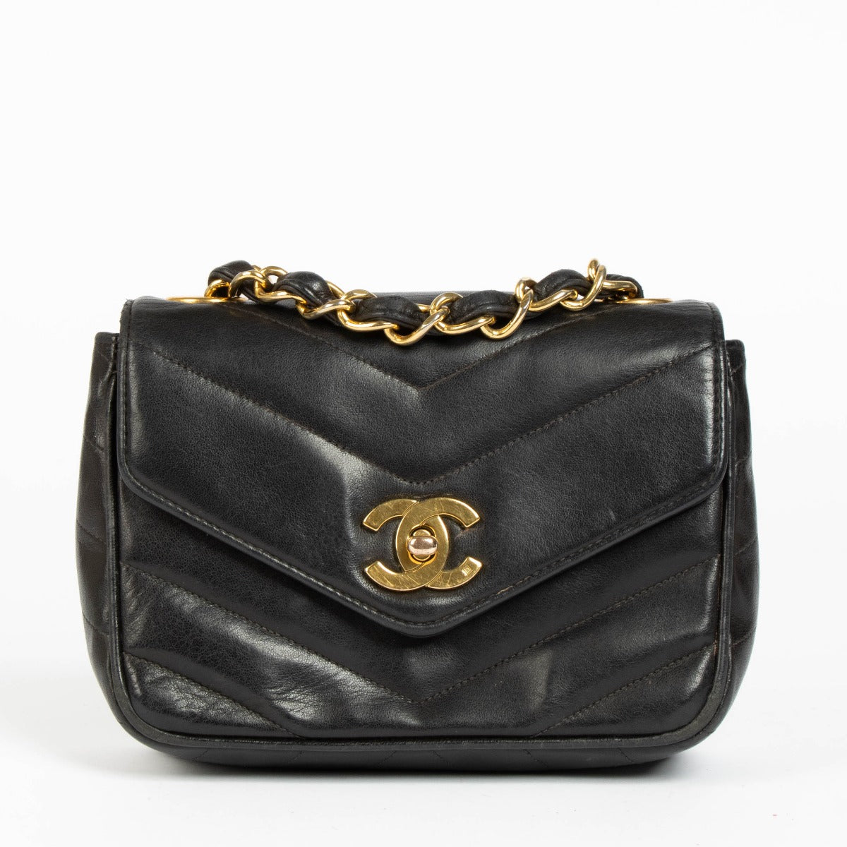 Shop this 100% authentic Chanel Black Lambskin Leather Mini Chevron Flap Bag at labellov.com.