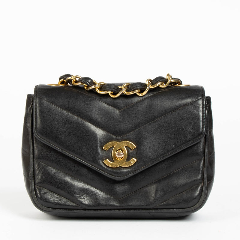Shop this 100% authentic Chanel Black Lambskin Leather Mini Chevron Flap Bag at labellov.com.