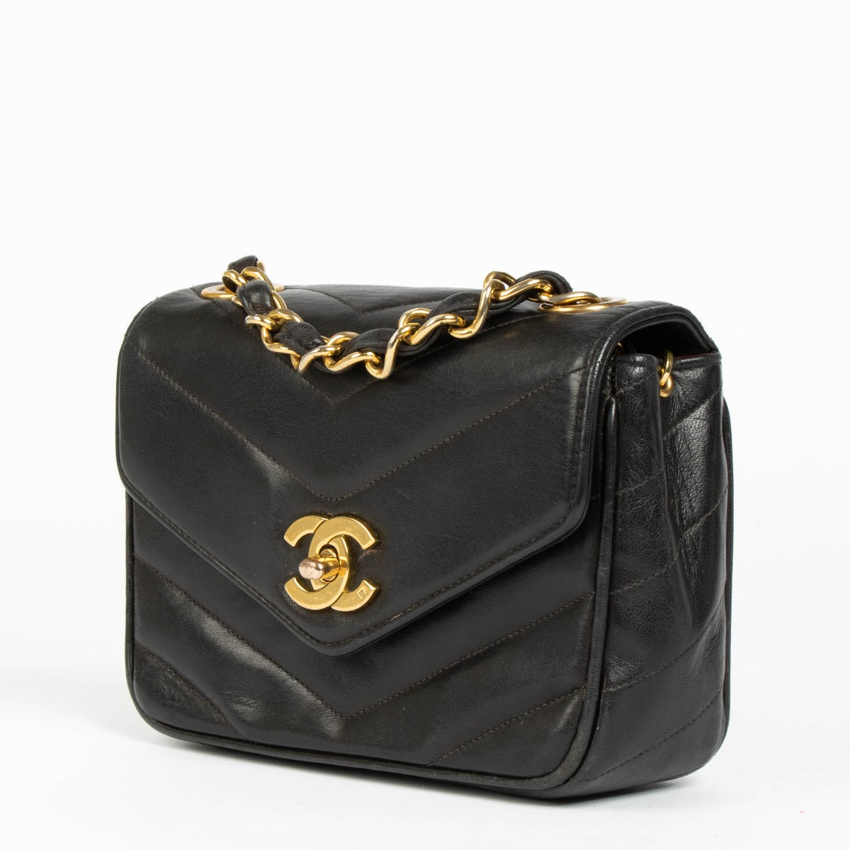 Shop this 100% authentic Chanel Black Lambskin Leather Mini Chevron Flap Bag at labellov.com.