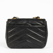 Shop this 100% authentic Chanel Black Lambskin Leather Mini Chevron Flap Bag at labellov.com.