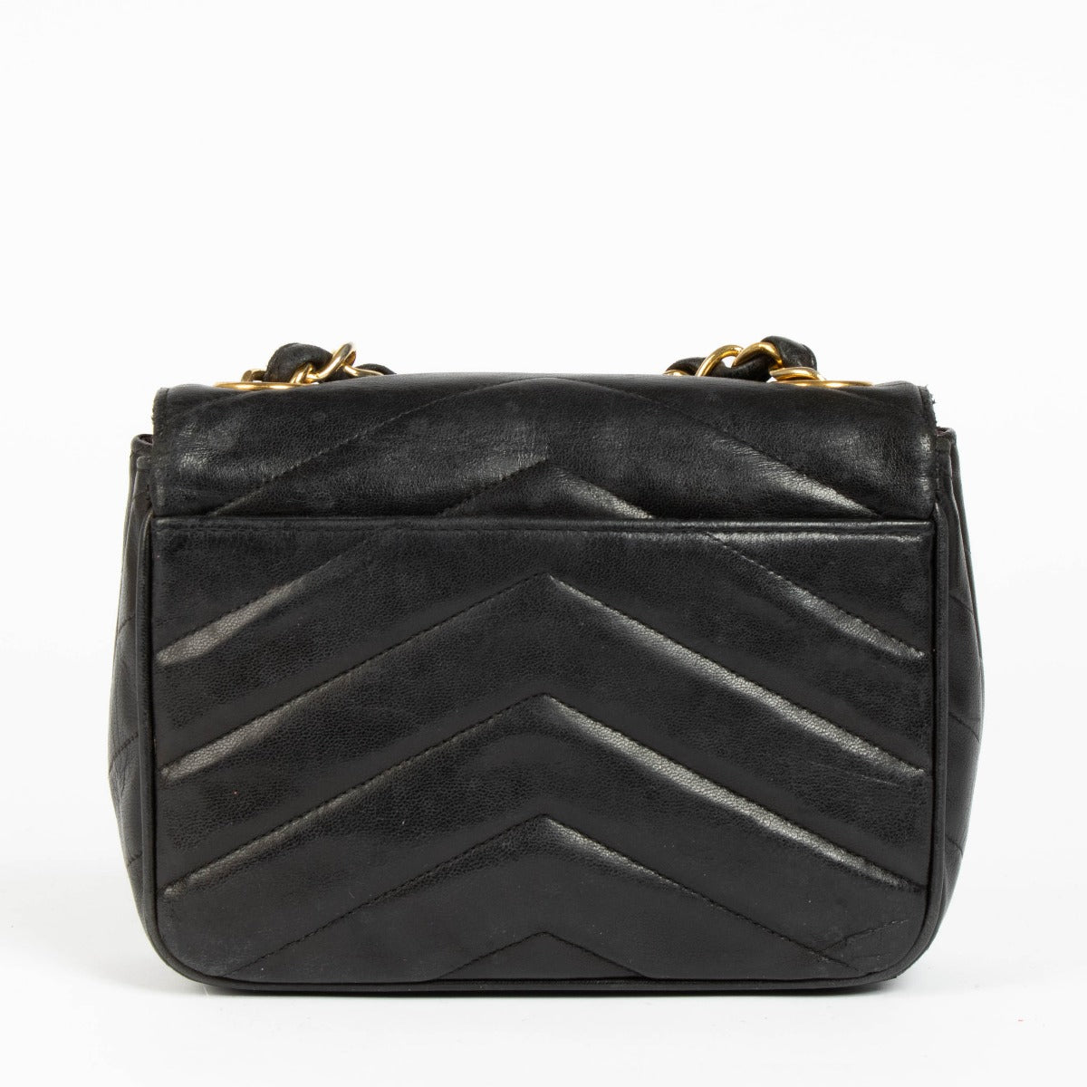 Shop this 100% authentic Chanel Black Lambskin Leather Mini Chevron Flap Bag at labellov.com.