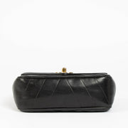 Shop this 100% authentic Chanel Black Lambskin Leather Mini Chevron Flap Bag at labellov.com.