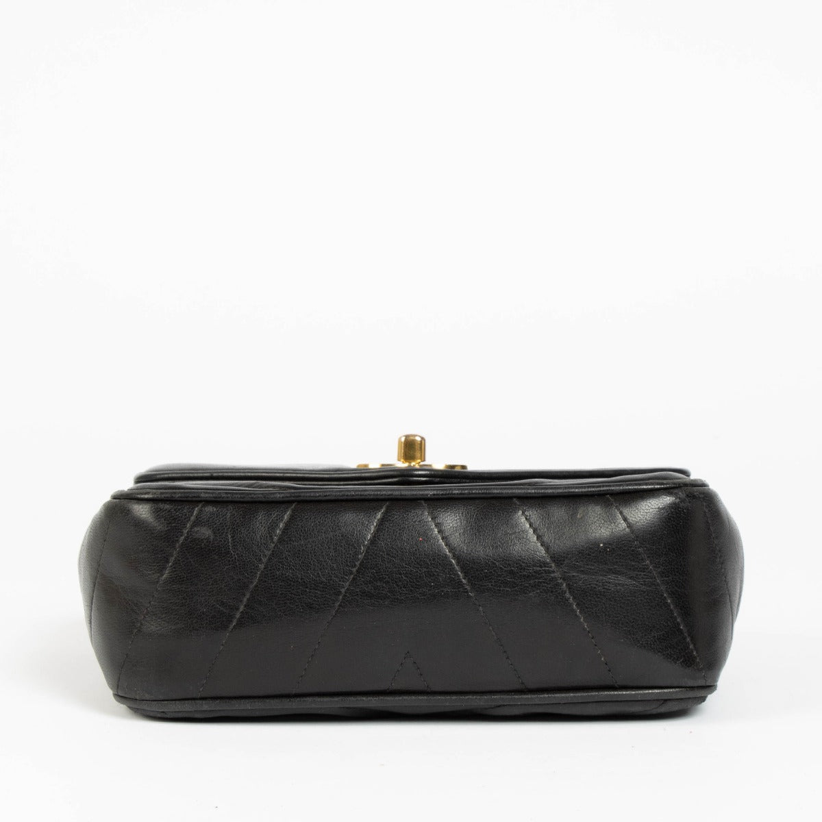 Shop this 100% authentic Chanel Black Lambskin Leather Mini Chevron Flap Bag at labellov.com.