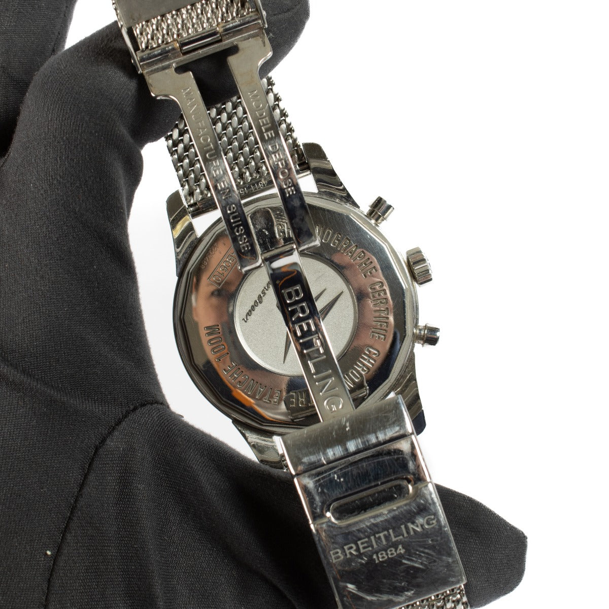 The Breitling Transocean Chronograph is a sophisticated timepiece featuring a 43mm stainless steel case, a sleek black dial, and a transparent case back. It comes complete with original booklets and a certificate of authenticity. Shop now at Labellov.