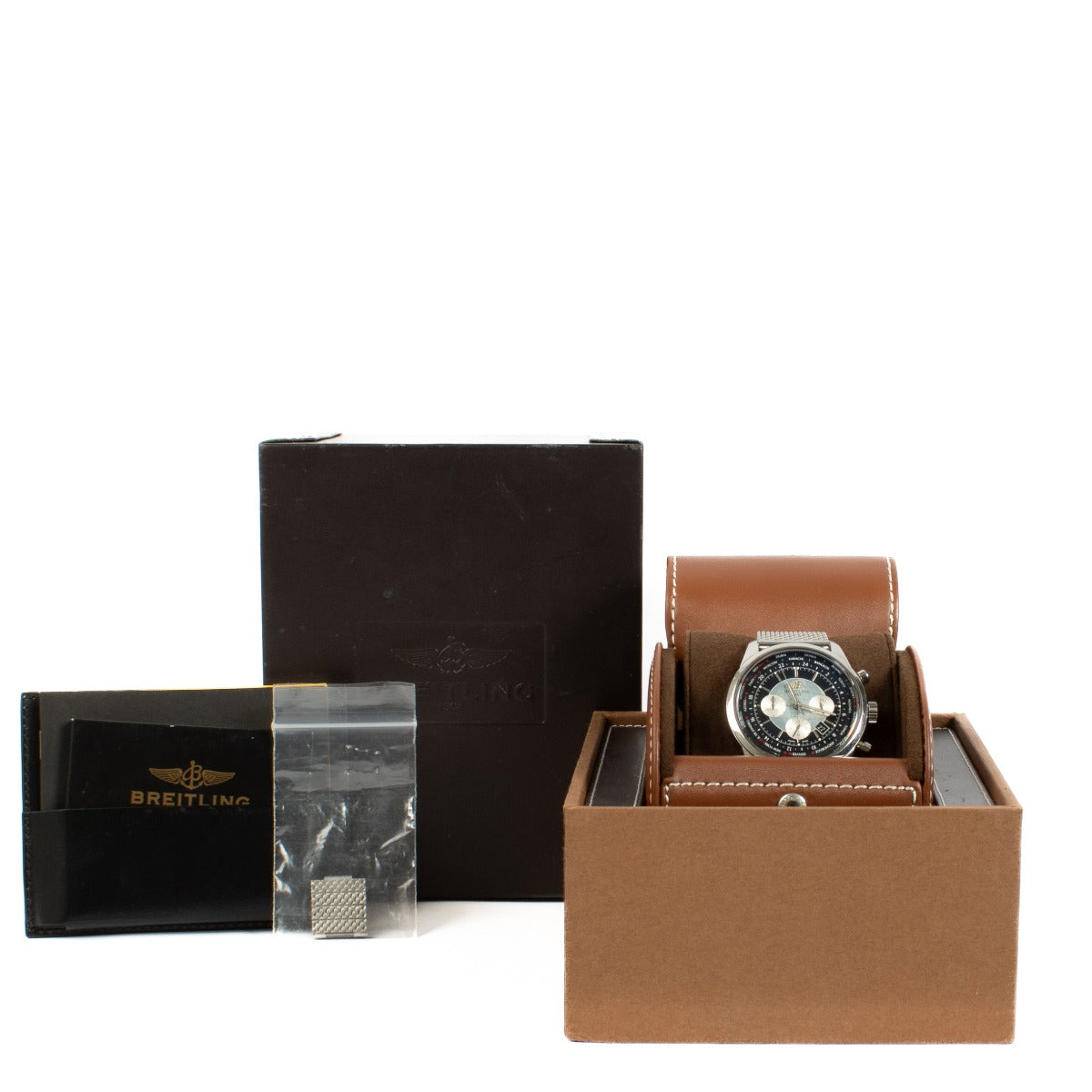 The Breitling Transocean Chronograph is a sophisticated timepiece featuring a 43mm stainless steel case, a sleek black dial, and a transparent case back. It comes complete with original booklets and a certificate of authenticity. Shop now at Labellov.