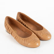 Shop Chanel Pink Ballerina Flats in size 37.5 at Labellov.com. Soft leather, ruched sides, iconic CC toe detail, and elegant metallic heel accent. Very good condition.