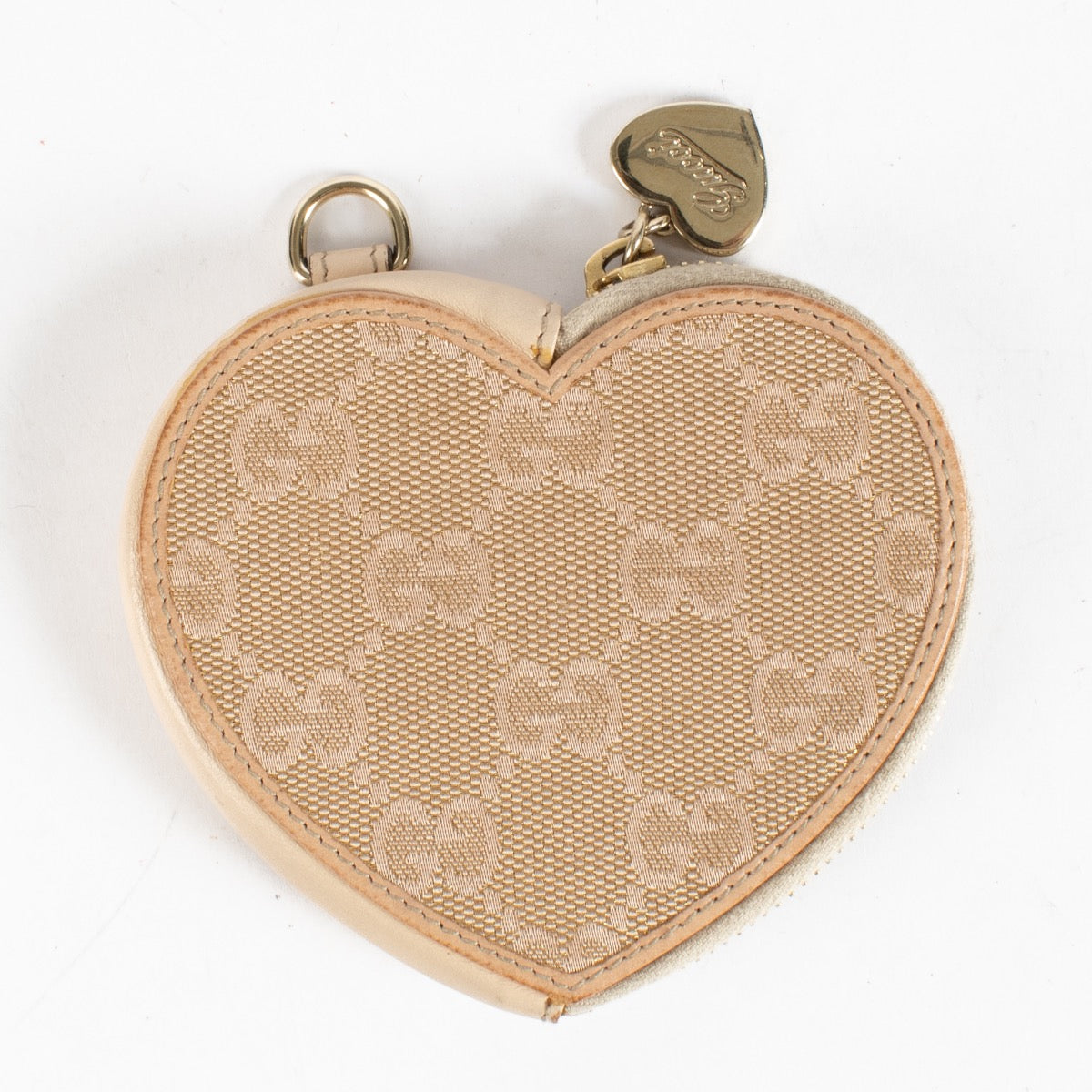 Discover the Gucci Beige GG Supreme Heart Coin Purse at Labellov.com. Cute, compact and elegant—perfect as a mini wallet or bag charm. Shop authenticated luxury.