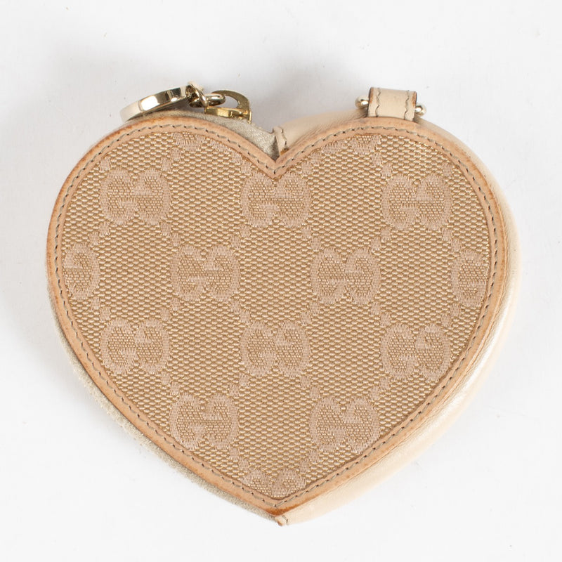 Discover the Gucci Beige GG Supreme Heart Coin Purse at Labellov.com. Cute, compact and elegant—perfect as a mini wallet or bag charm. Shop authenticated luxury.