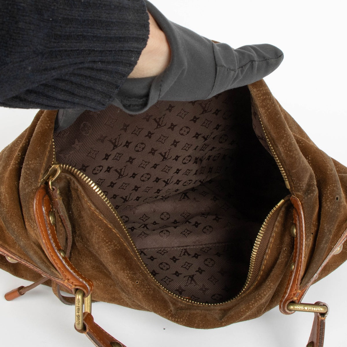 Shop this 100% authentic Louis Vuitton Brown Suede Onatah Hobo Bag at labellov.com