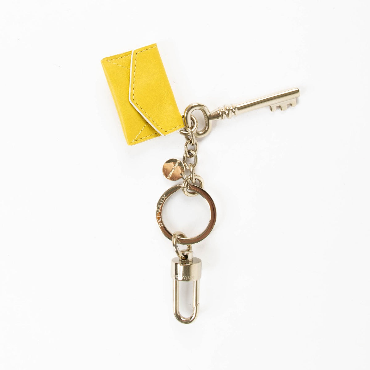 shop safe online at Labellov in Antwerp, Brussels and Knokke this 100% authentic second hand Delvaux Yellow Envelope Key Charm