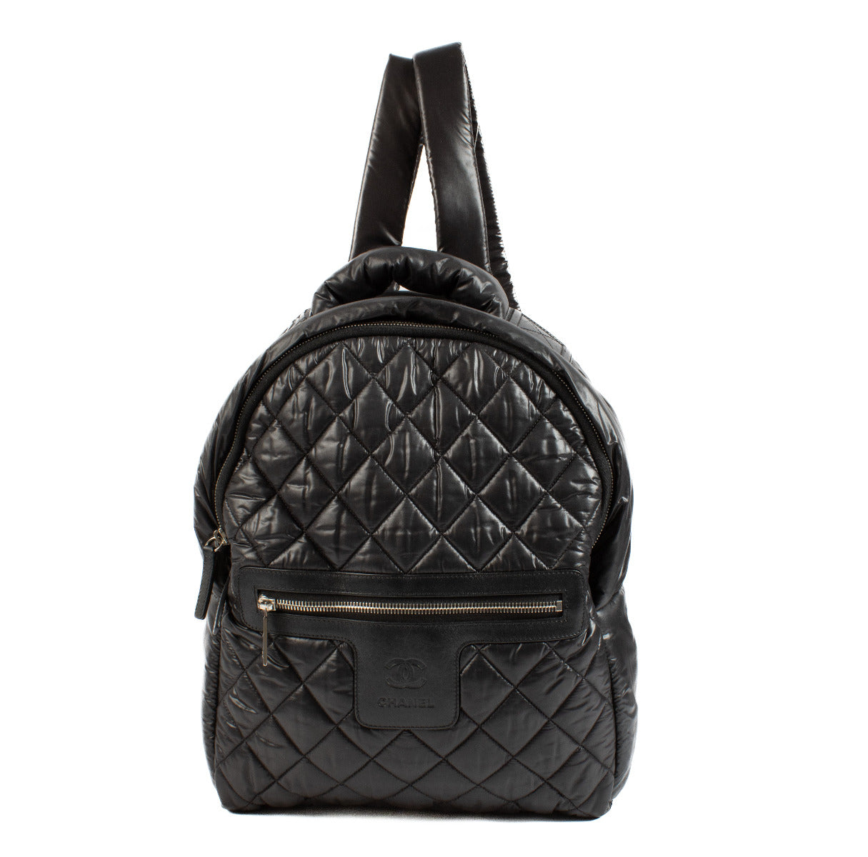 Add a touch of contemporary chic to your collection with this Chanel Black Nylon Cocoon Backpack. Crafted from lightweight, quilted nylon, this backpack offers both style and practicality, making it perfect for on-the-go luxury. Its sleek black design is