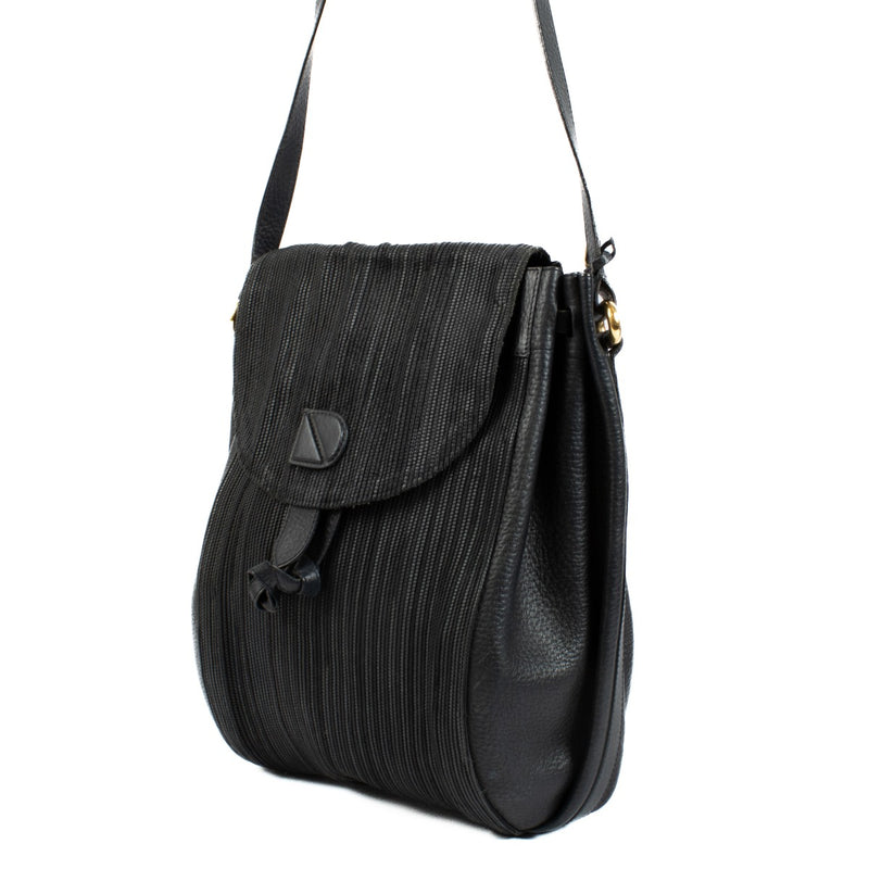 Delvaux dark blue bag with Toile de Cuir center panel and leather sides, featuring a fully leather-lined interior. Shop now on Labellov.com.