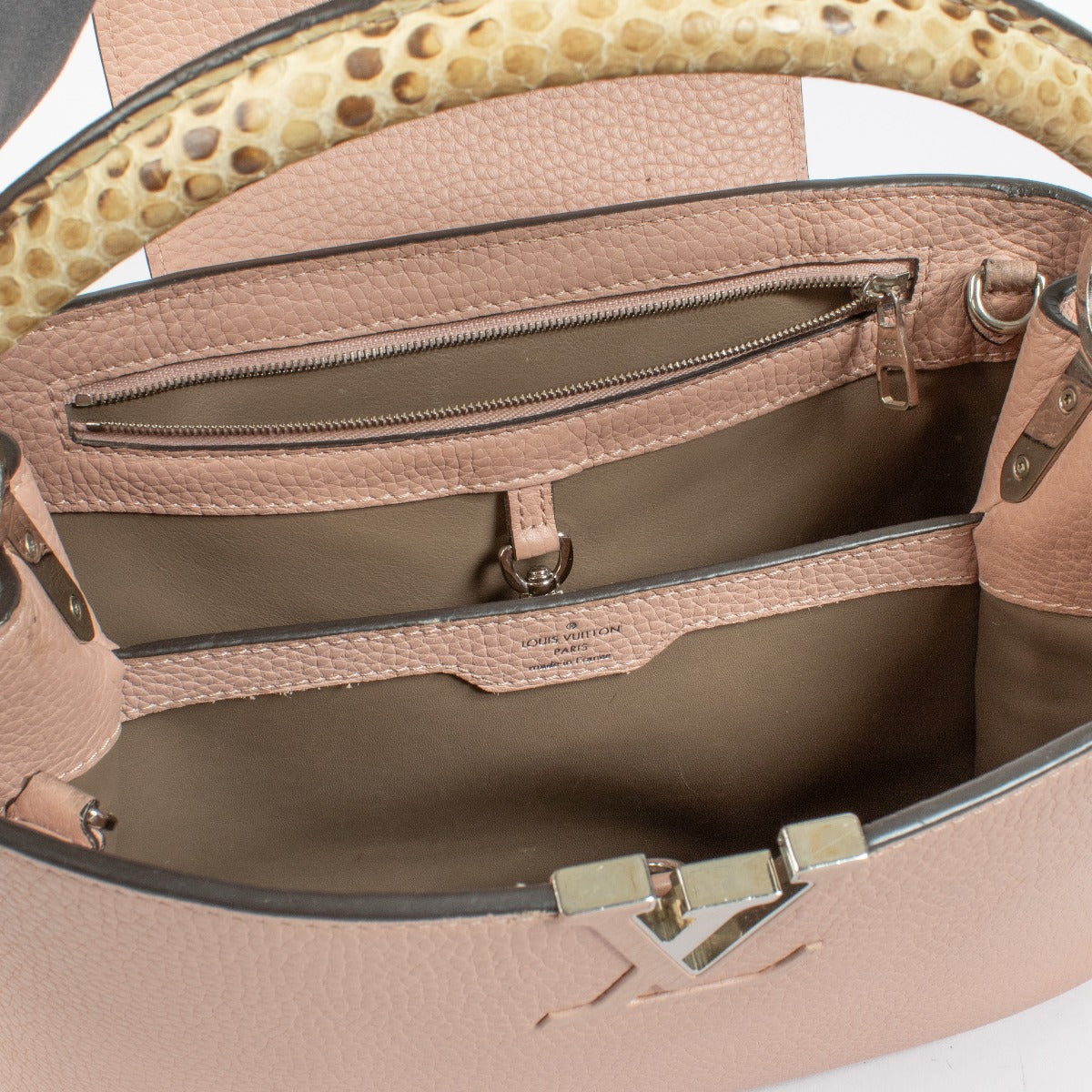 Discover the pre-loved Louis Vuitton Capucines MM in Galet with rare python handle and signature LV monogram. A timeless luxury handbag available at Labellov – your destination for designer bags in Antwerpen and Knokke.