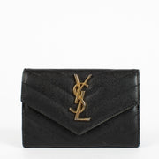 Shop the pre-loved Saint Laurent Black Cassandre Wallet in grained leather with gold YSL logo. A sleek designer essential, now available at Labellov in Antwerpen and Knokke.