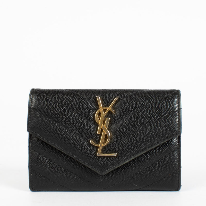 Shop the pre-loved Saint Laurent Black Cassandre Wallet in grained leather with gold YSL logo. A sleek designer essential, now available at Labellov in Antwerpen and Knokke.