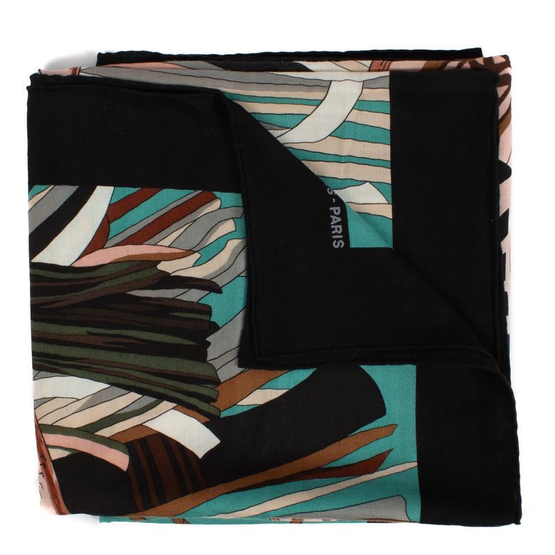 This Hermès scarf features a rose-colored background with turquoise, rose, green, and brown patterns. Cuir de Désert. Made from high-quality silk, it adds a pop of color and sophistication to any outfit. Shop now on Labellov.com