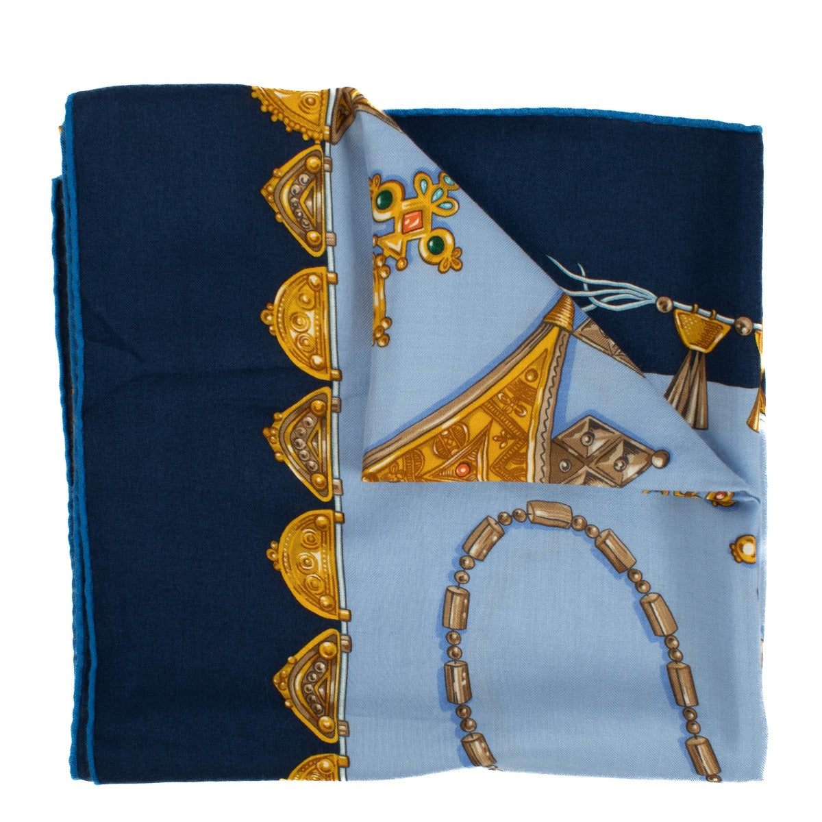 Hermès Parures Des Sables shawl featuring intricate desert-inspired patterns in soft earthy tones with vivid accents, crafted from luxurious materials.Shop now on Labellov.com.