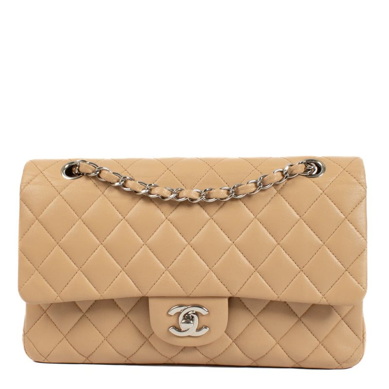 The Chanel Beige Lambskin Medium Classic 11.12 Bag exudes timeless elegance with its buttery-soft lambskin leather, gold-tone hardware, and iconic turn-lock closure. A must-have luxury piece. Shop now on Labellov.com.