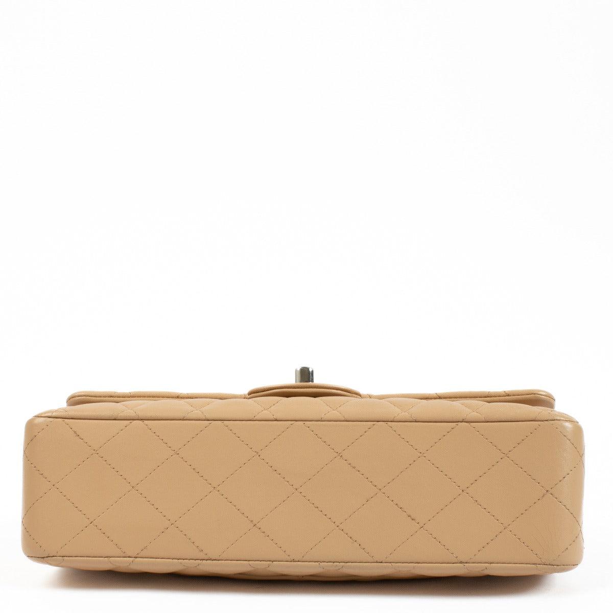 The Chanel Beige Lambskin Medium Classic 11.12 Bag exudes timeless elegance with its buttery-soft lambskin leather, gold-tone hardware, and iconic turn-lock closure. A must-have luxury piece. Shop now on Labellov.com.