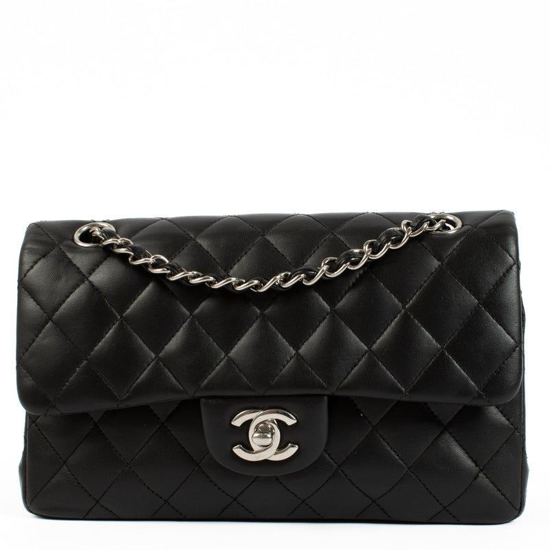 Chanel Black Lambskin Small Classic Bag with silver-tone hardware and turnlock closure, showcasing a smooth, elegant finish. Shop now on Labellov.com.