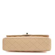 Discover the timeless elegance of the Chanel Beige Caviar Medium Classic 11.12 Bag. Crafted from durable caviar leather with gold-tone hardware, this iconic designer bag offers a perfect blend of luxury and practicality. Shop now on Labellov.com.