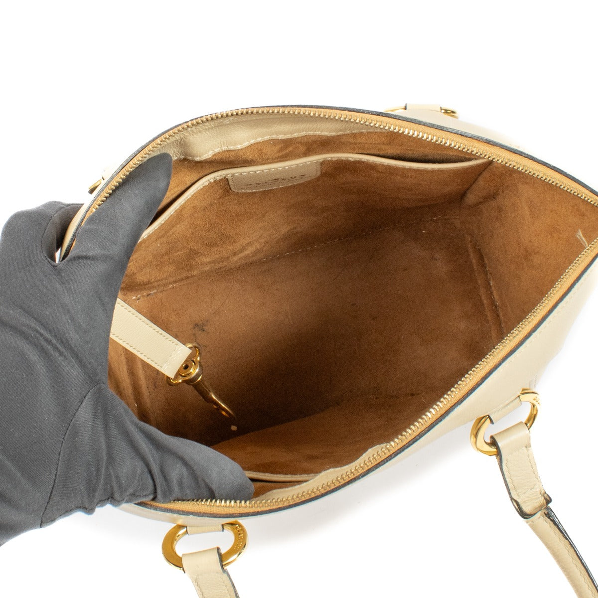 Delvaux Beige Charme Bag with slight wear on straps, bottom, and interior, overall in very good condition. Order on Labellov.com.