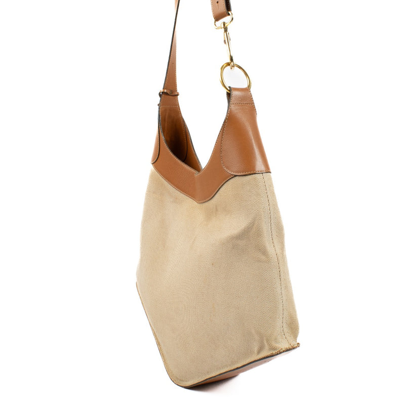 Elegant everyday bag with brown details, durable canvas, and gold hardware, perfect for carrying all your essentials now at Labellov.