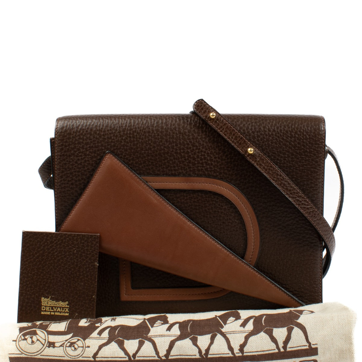 Delvaux brown bag with an adjustable strap, perfect for everyday elegance. Comes with a dust bag. Shop at Labellov.