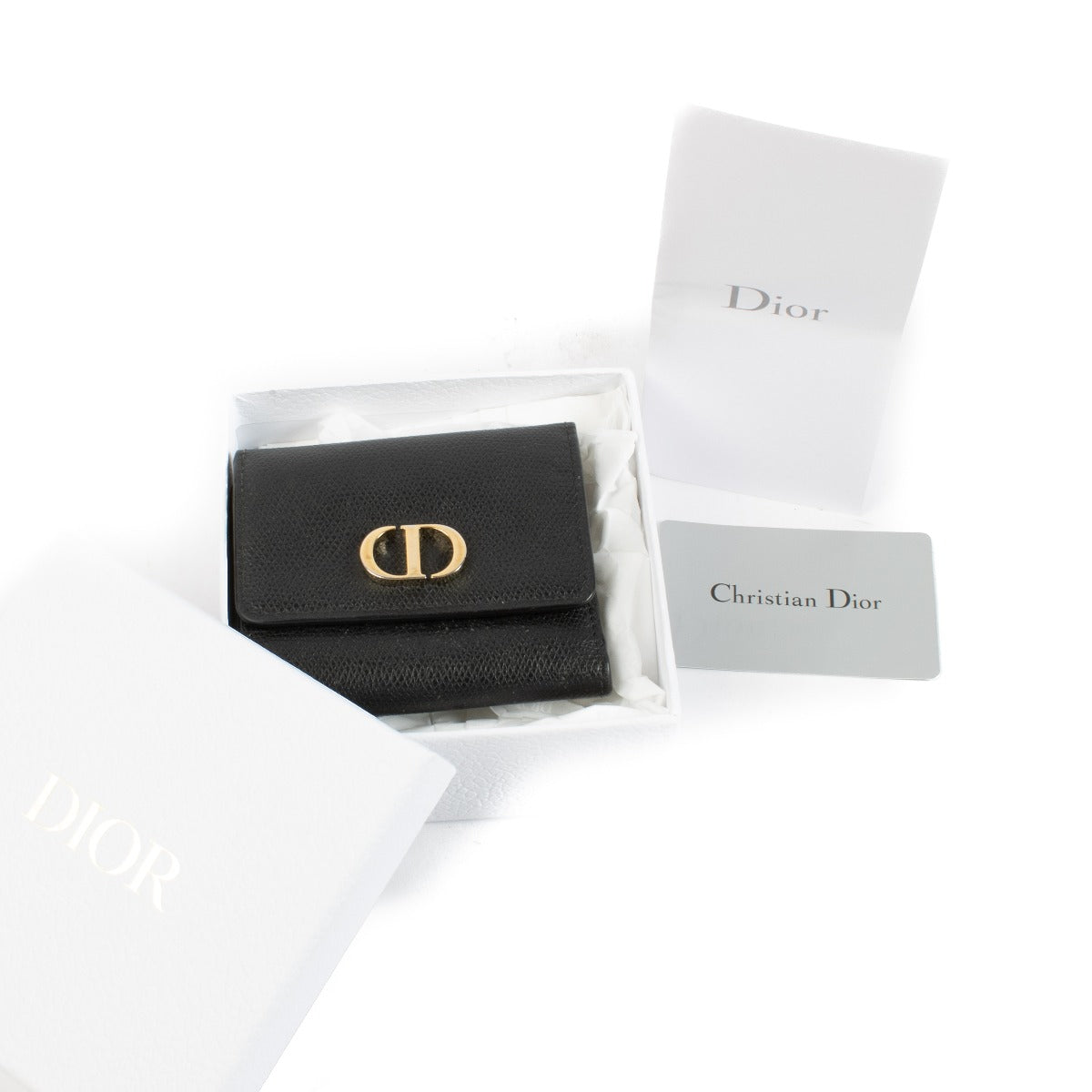 Christian Dior Black Leather 30 Montaigne Wallet with gold-tone logo hardware. Shop at Labellov.