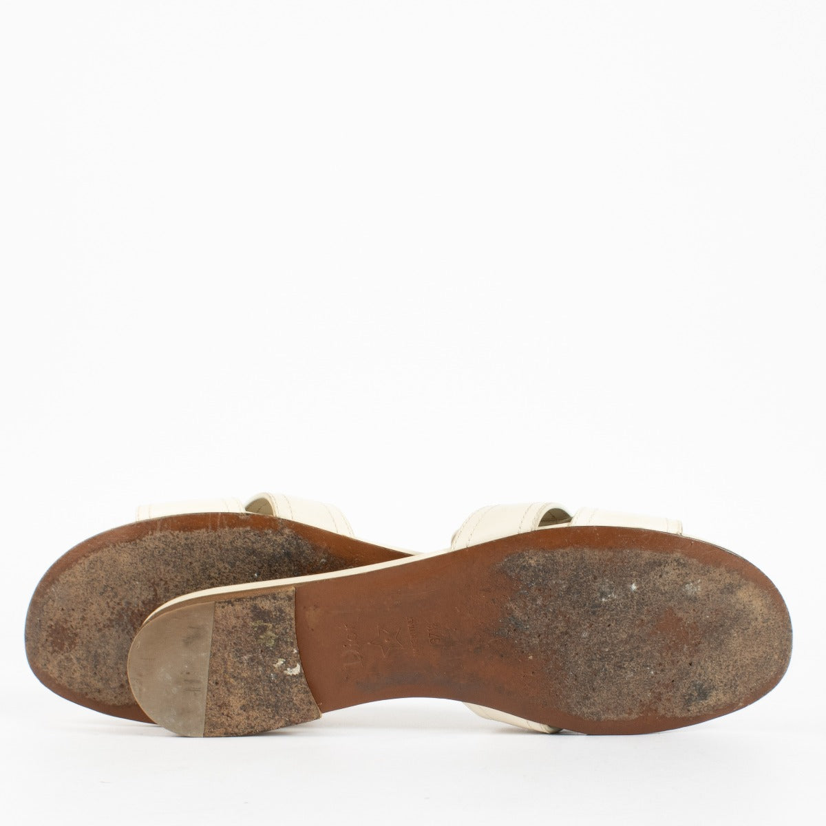 Shop pre-loved Christian Dior White Sandals featuring gold CD logo and smooth calfskin leather. A chic summer essential available now at Labellov, your trusted destination for luxury designer shoes in Antwerpen and Knokke.