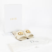 Shop pre-loved Christian Dior White Sandals featuring gold CD logo and smooth calfskin leather. A chic summer essential available now at Labellov, your trusted destination for luxury designer shoes in Antwerpen and Knokke.