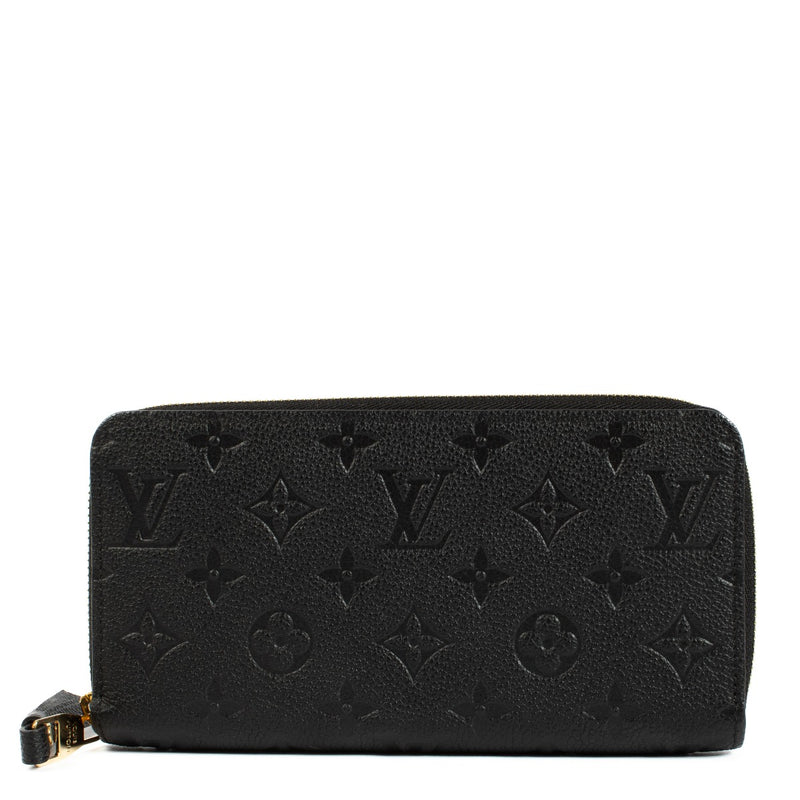 Louis Vuitton Monogram Empreinte Wallet crafted from embossed Monogram Empreinte leather. A sleek, elegant wallet with multiple compartments for cards, cash, and coins. Shop at Labellov.
