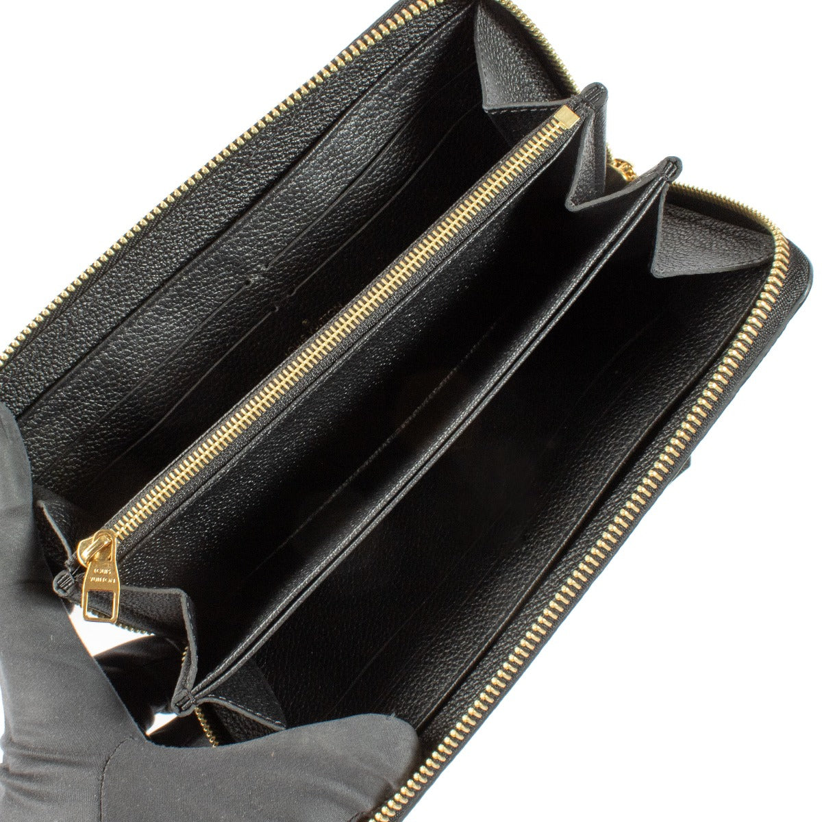 Louis Vuitton Monogram Empreinte Wallet crafted from embossed Monogram Empreinte leather. A sleek, elegant wallet with multiple compartments for cards, cash, and coins. Shop at Labellov.