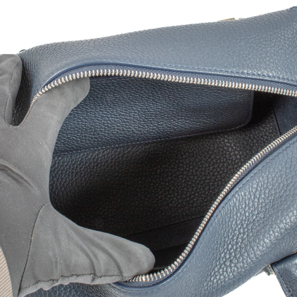 Delvaux Cool Box MM Navy Blue Taurillon Soft Bag in excellent condition, featuring supple navy blue leather, a zip-around closure, and a spacious interior, perfect for daily essentials.