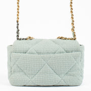 Shop safe online at Labellov in Antwerp, Brussels and Knokke this 100% authentic second hand Chanel Light Blue Tweed Medium Chanel 19 Bag