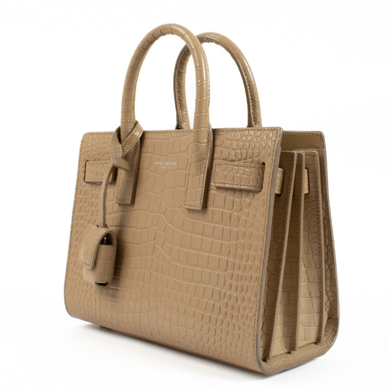 Saint Laurent Nano Sac De Jour Beige Crocodile Embossed Bag for the best price at Labellov secondhand luxury in Antwerp and Knokke.