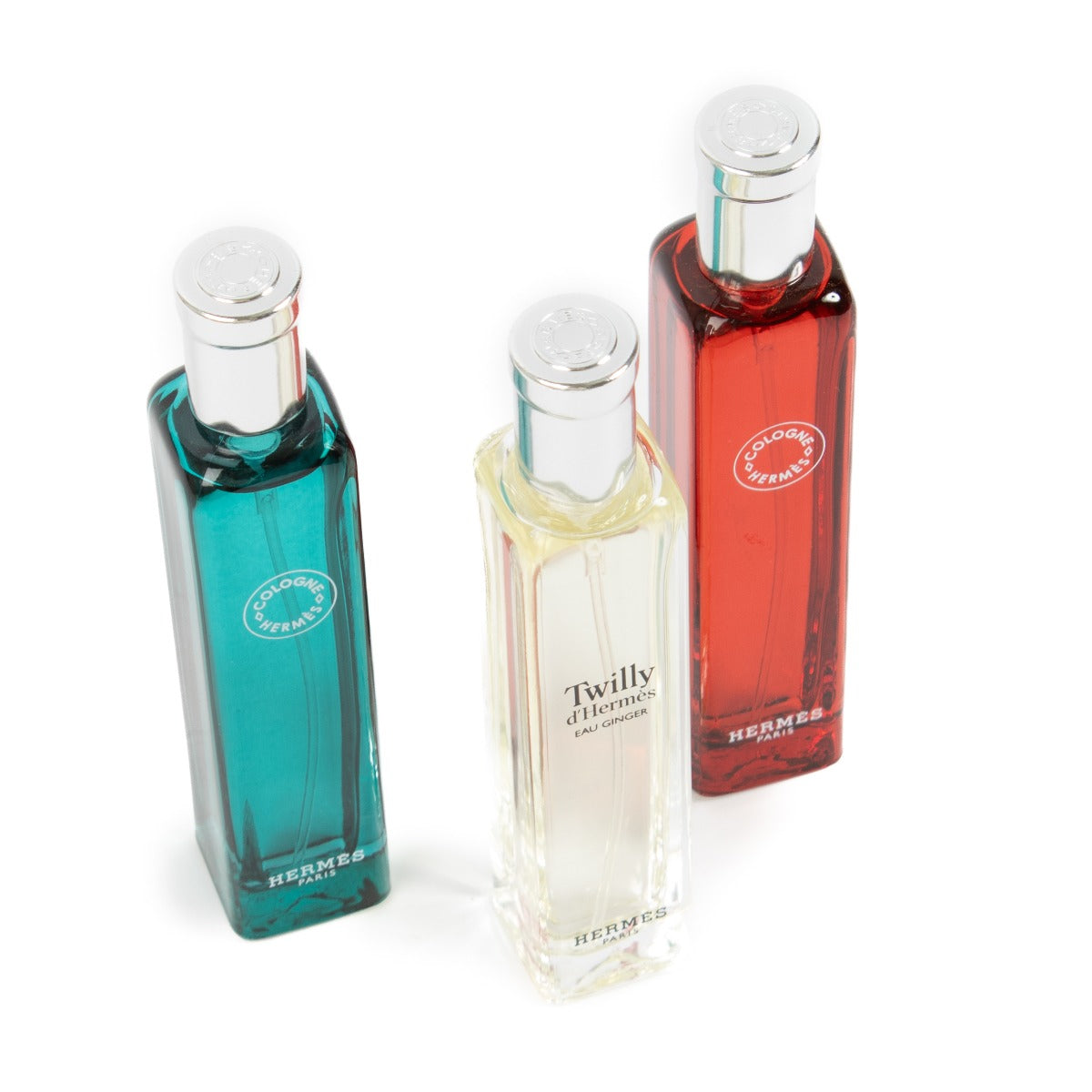 Hermès set of 3 travel perfumes, featuring 15ml bottles of Eau de Rhubarbe Écarlate, Eau de Cologne, and Eau d'Orange Verte, offering refreshing and vibrant fragrances in a compact, travel-friendly design. Shop now at Labellov.