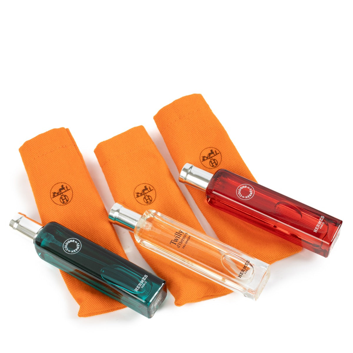 Hermès set of 3 travel perfumes, featuring 15ml bottles of Eau de Rhubarbe Écarlate, Eau de Cologne, and Eau d'Orange Verte, offering refreshing and vibrant fragrances in a compact, travel-friendly design. Shop now at Labellov.