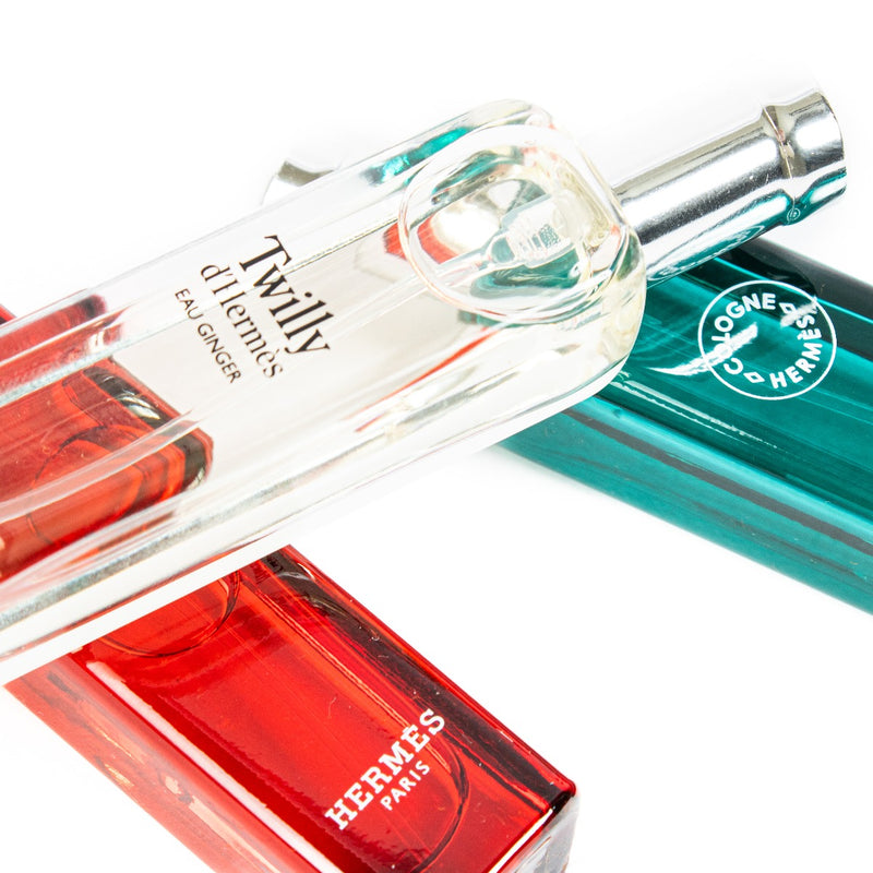 Hermès set of 3 travel perfumes, featuring 15ml bottles of Eau de Rhubarbe Écarlate, Eau de Cologne, and Eau d'Orange Verte, offering refreshing and vibrant fragrances in a compact, travel-friendly design. Shop now at Labellov.