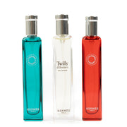 Hermès set of 3 travel perfumes, featuring 15ml bottles of Eau de Rhubarbe Écarlate, Eau de Cologne, and Eau d'Orange Verte, offering refreshing and vibrant fragrances in a compact, travel-friendly design. Shop now at Labellov.