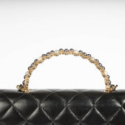 Authentic pre-loved Chanel Black Lambskin Pearl Top Handle Clutch With Chain on Labellov.com