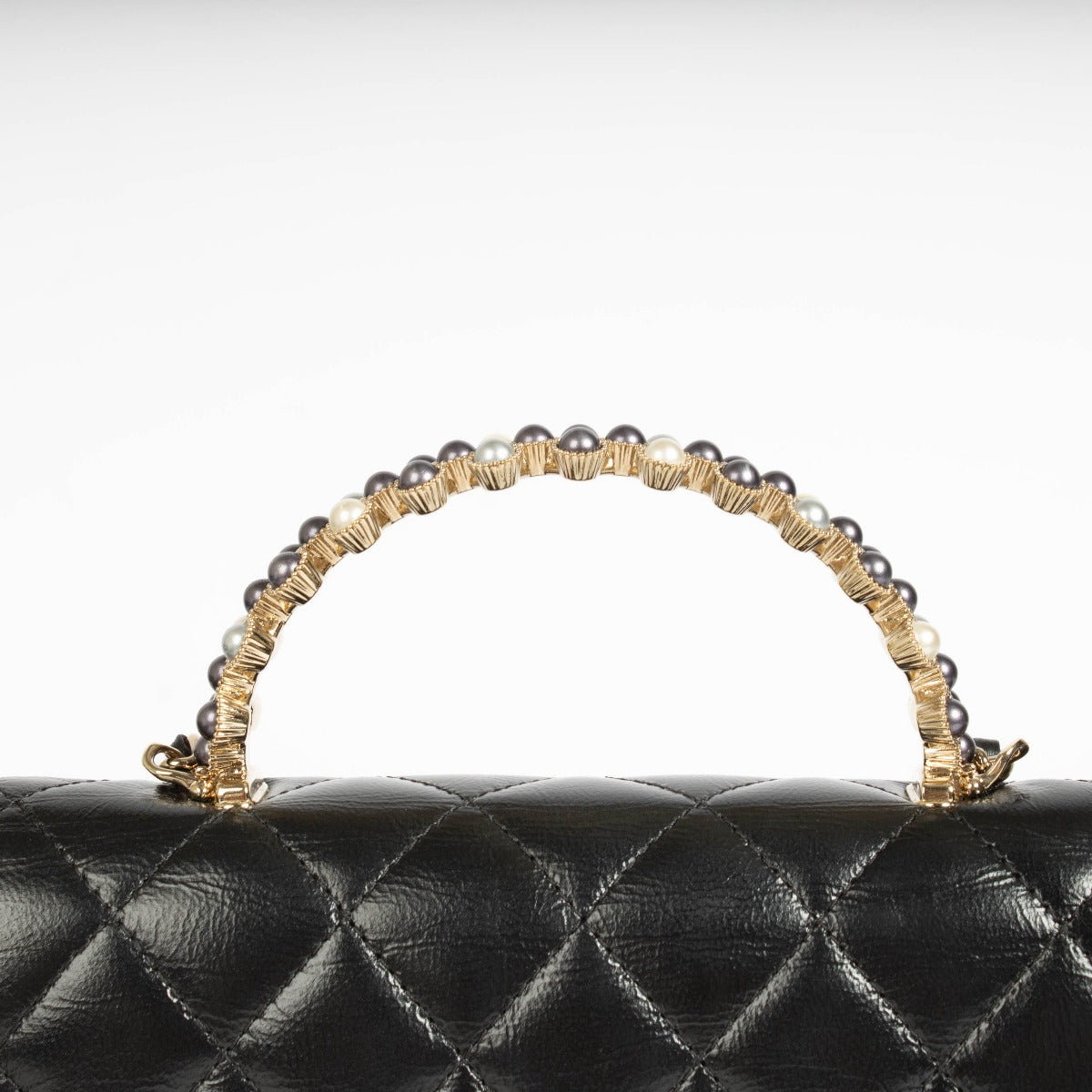 Authentic pre-loved Chanel Black Lambskin Pearl Top Handle Clutch With Chain on Labellov.com