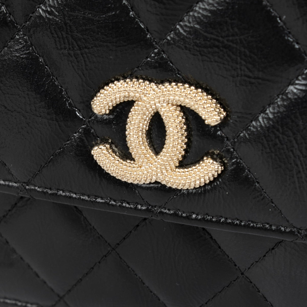 Authentic pre-loved Chanel Black Lambskin Pearl Top Handle Clutch With Chain on Labellov.com