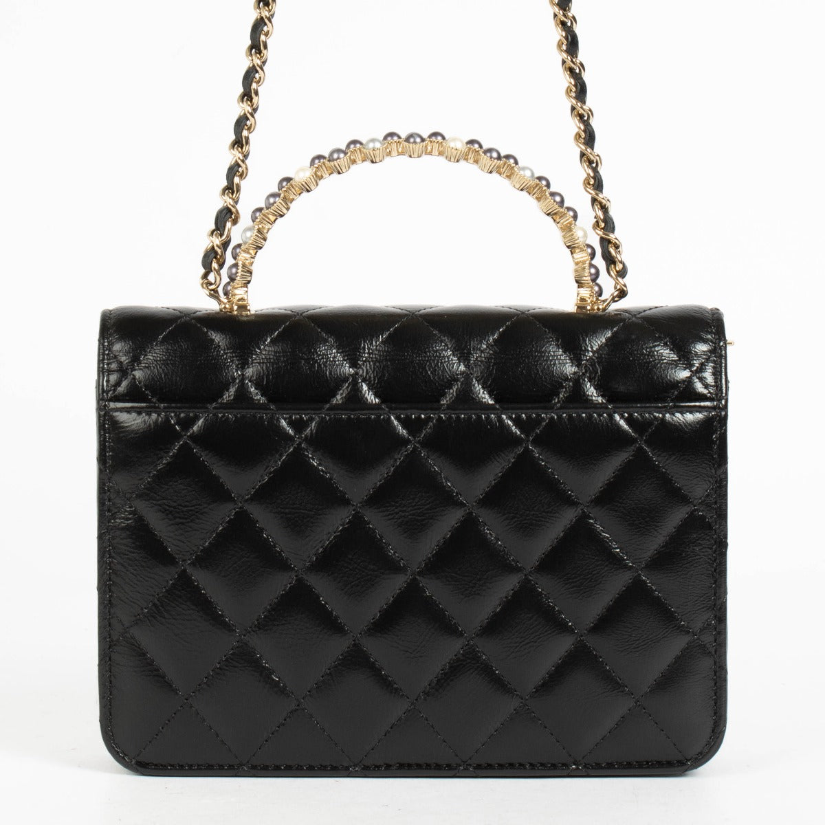 Authentic pre-loved Chanel Black Lambskin Pearl Top Handle Clutch With Chain on Labellov.com