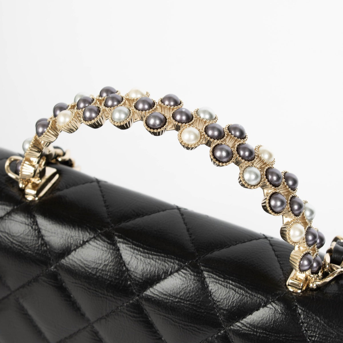 Authentic pre-loved Chanel Black Lambskin Pearl Top Handle Clutch With Chain on Labellov.com