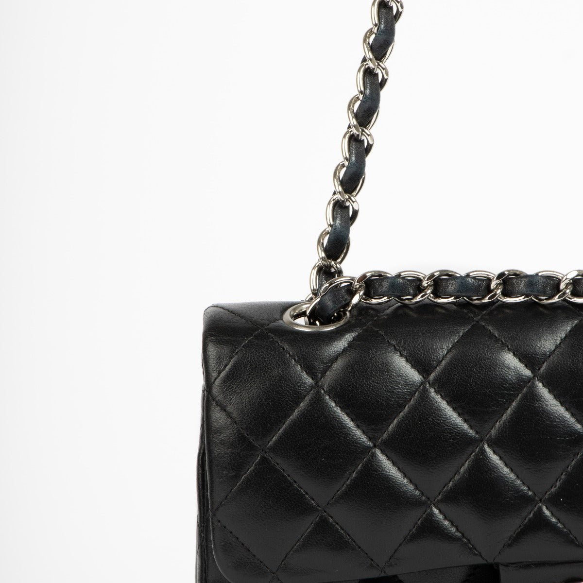 Shop this 100% authentic Chanel Black Lambskin Small Classic Handbag at Labellov.com