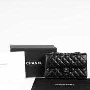 Shop this 100% authentic Chanel Black Lambskin Small Classic Handbag at Labellov.com