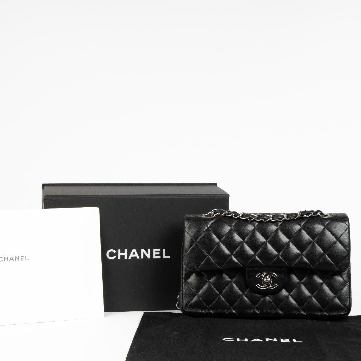 Shop this 100% authentic Chanel Black Lambskin Small Classic Handbag at Labellov.com