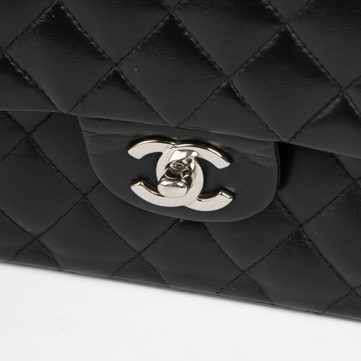 Shop this 100% authentic Chanel Black Lambskin Small Classic Handbag at Labellov.com